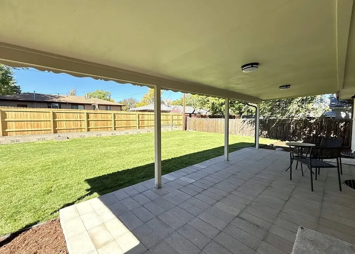The same backyard later, cleared and updated