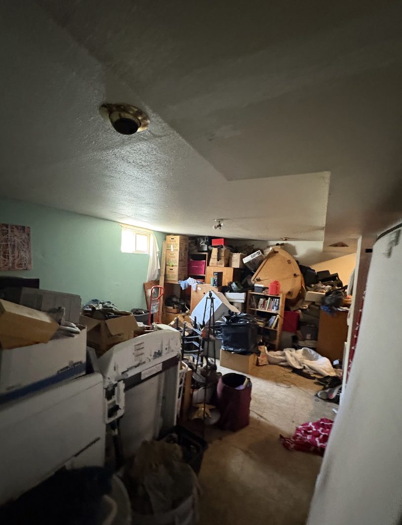 Basement full of stored items and boxes in a Lakewood house sold as-is for cash