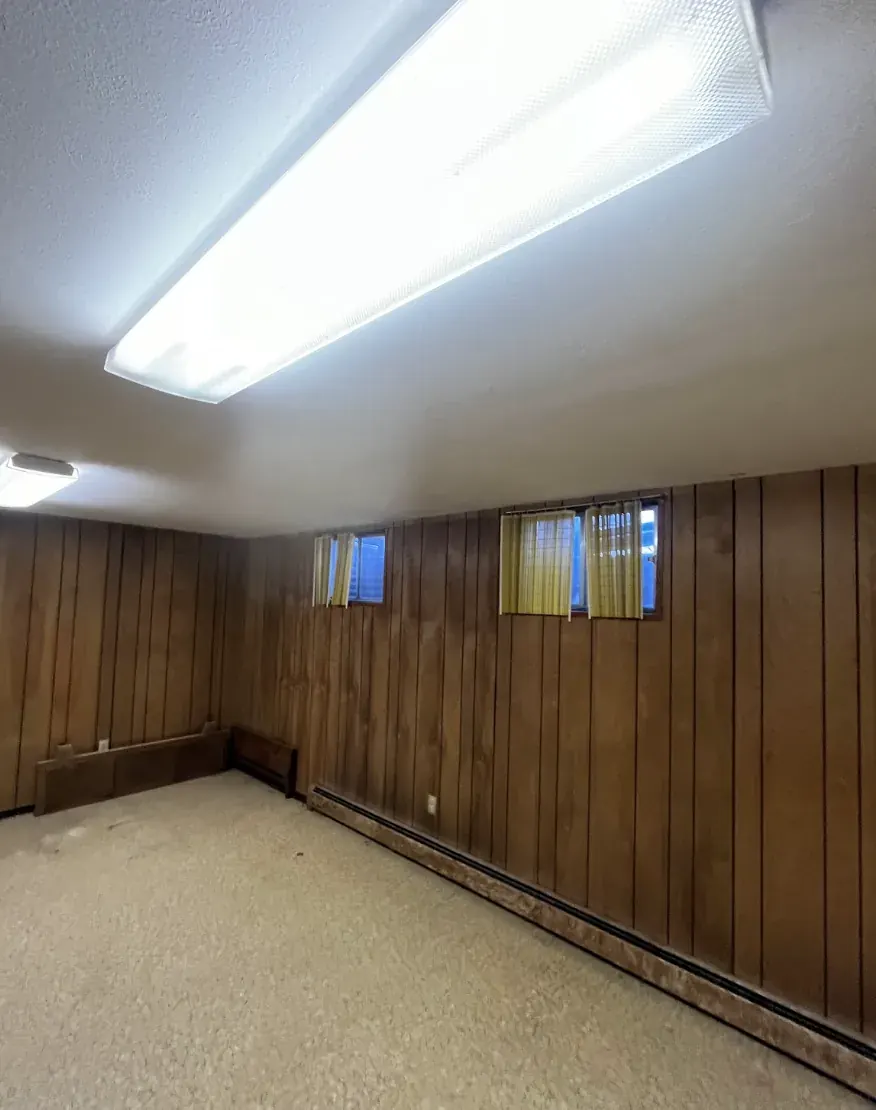 Basement of a Littleton, Colorado house bought as-is by Windcrest Investments, before