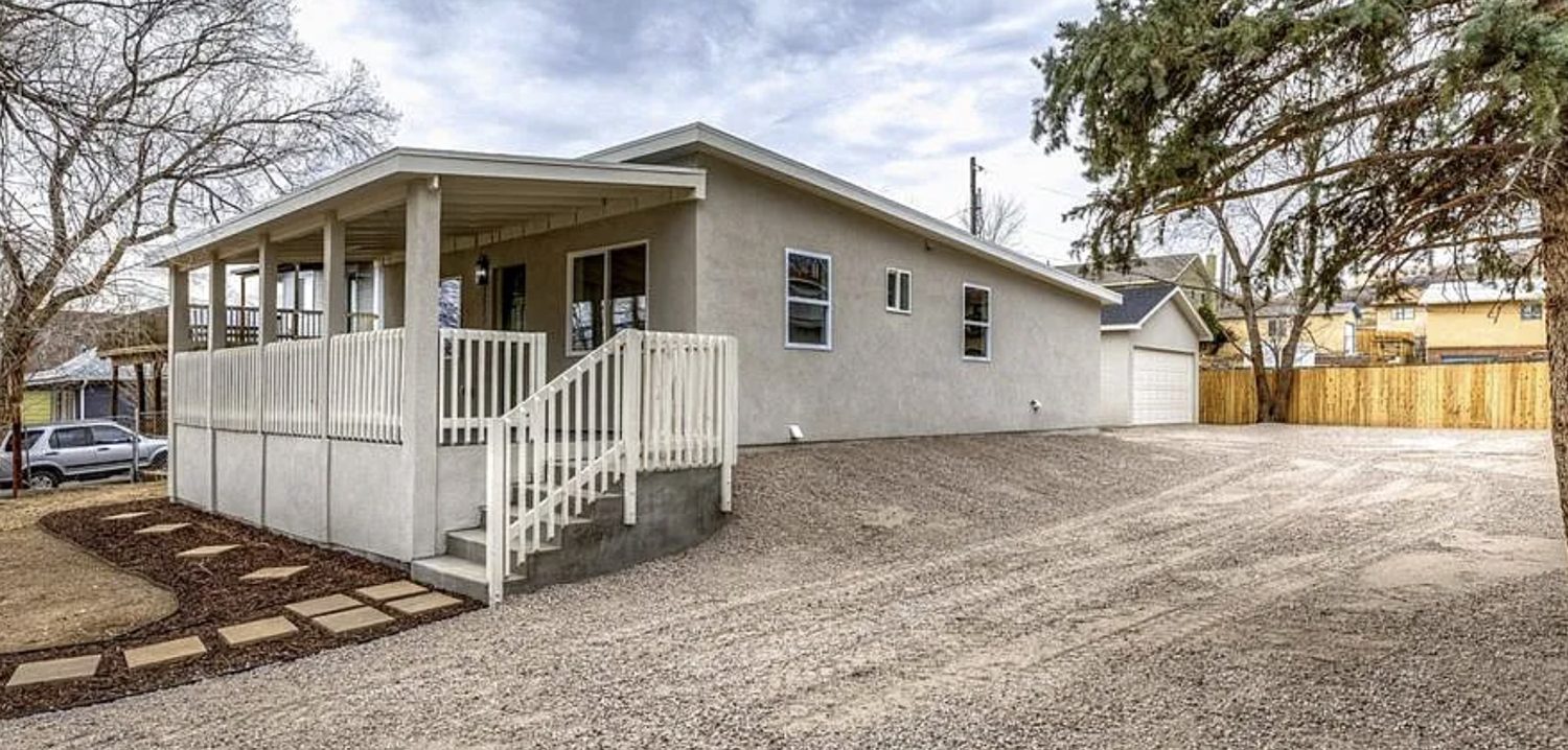 Renovated 1926 stucco ranch with a new covered porch in Colorado Springs 80904