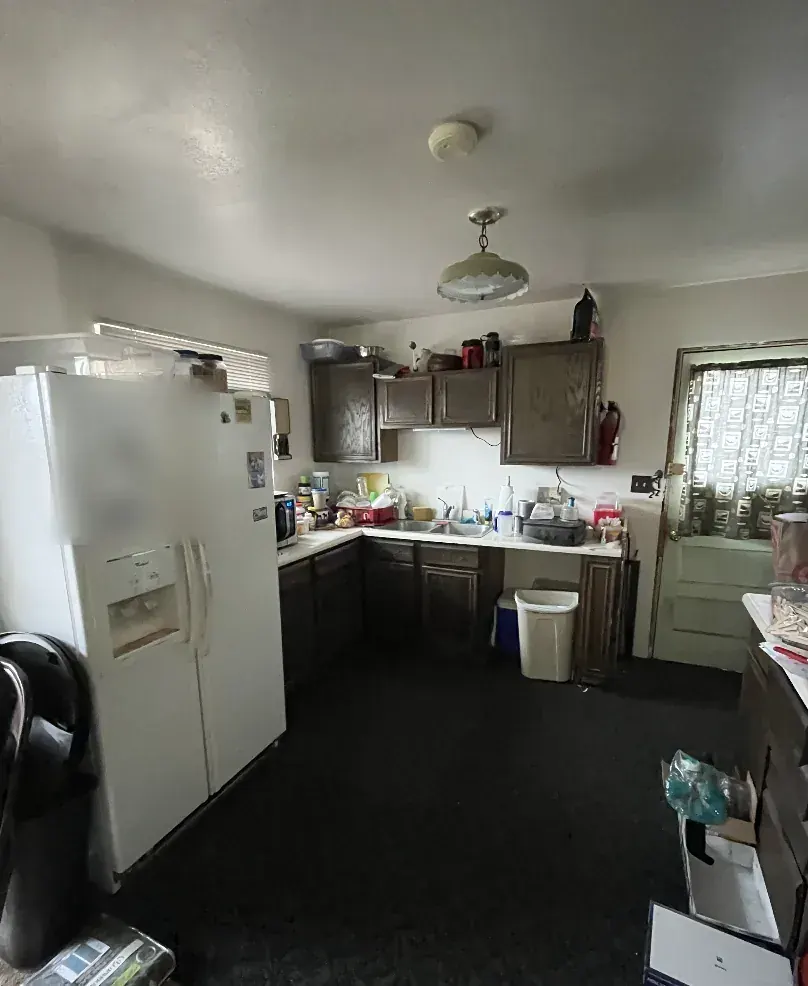 Kitchen of a Wheat Ridge, Colorado house bought as-is by Windcrest Investments, before